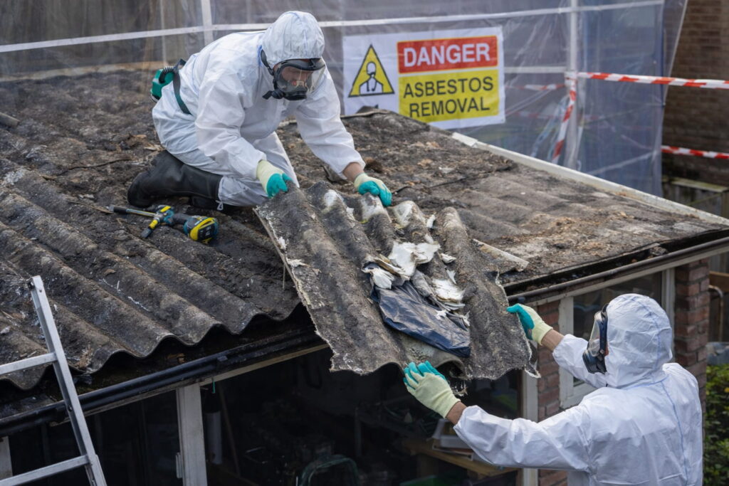 asbestos experts removing materials from building