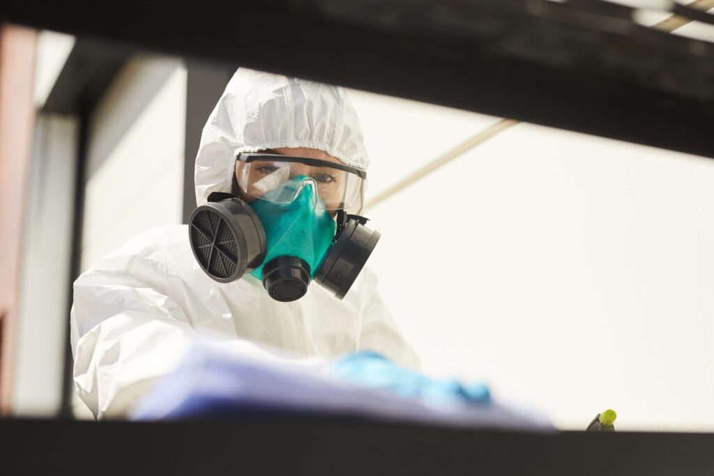 protective worker wearing mask and goggles at work